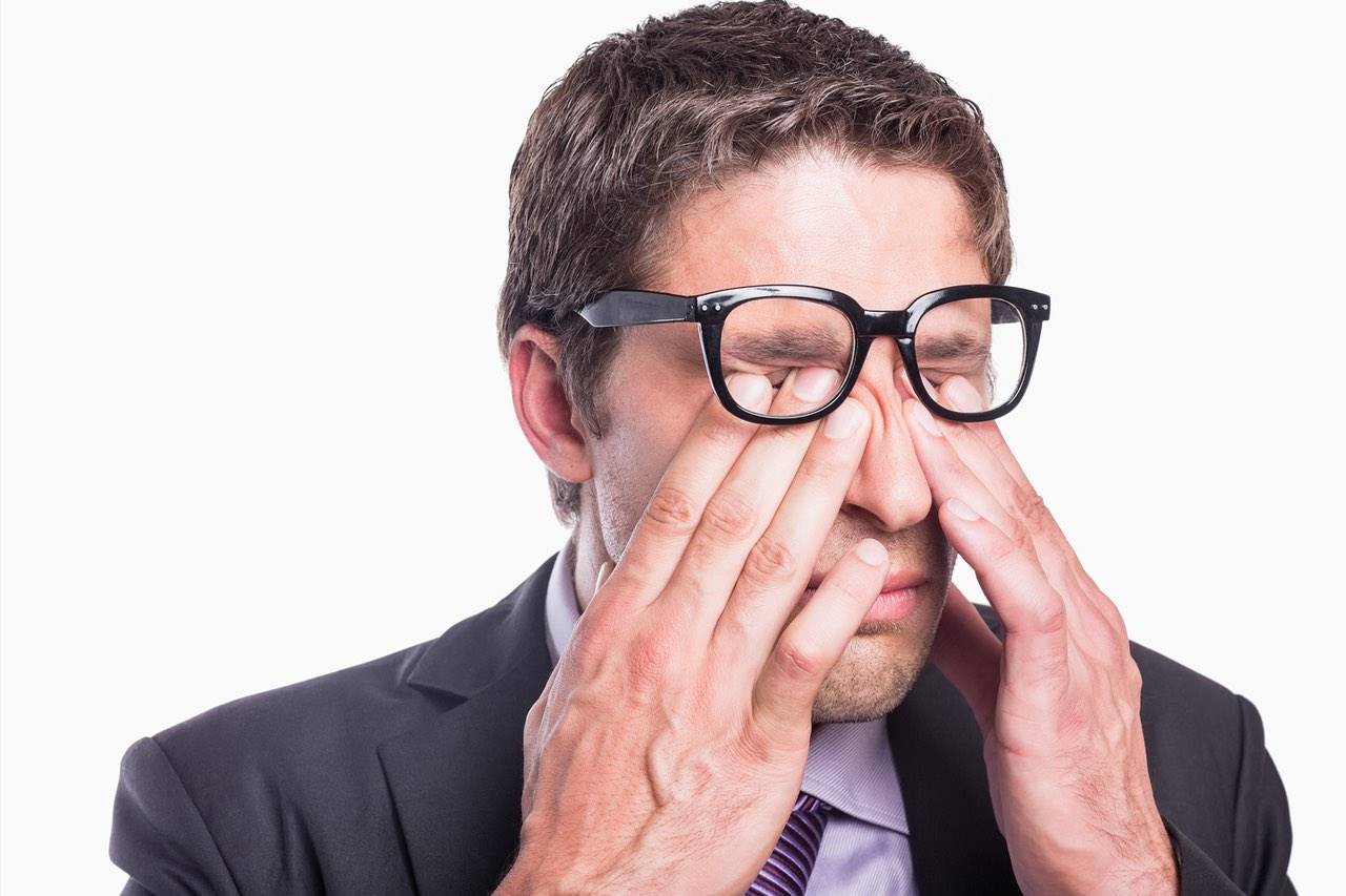 eye rub businessman