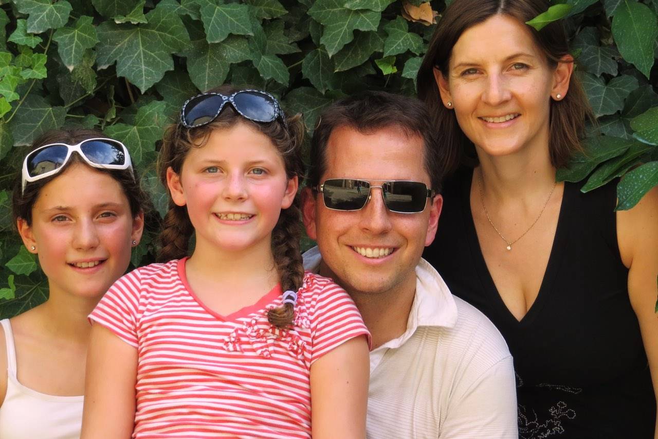 family in bushes with sunglasses