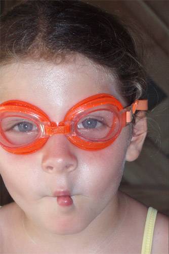Childl wearing prescription goggles