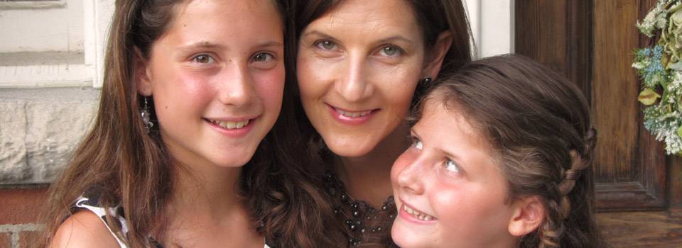 caucasian mother and her young daughters