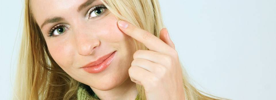 girl pointing to cheek